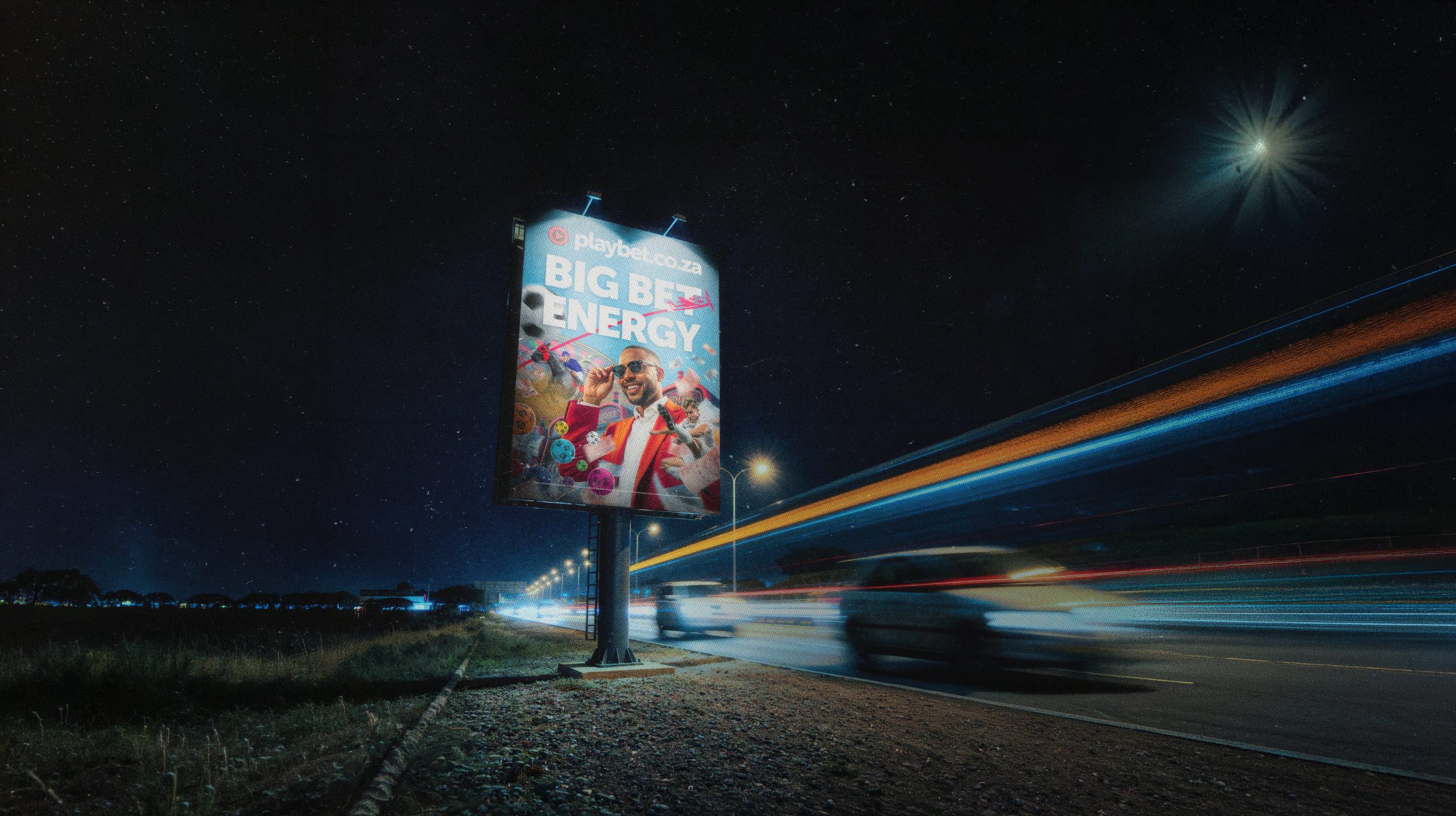 Illuminated billboard on a highway at night